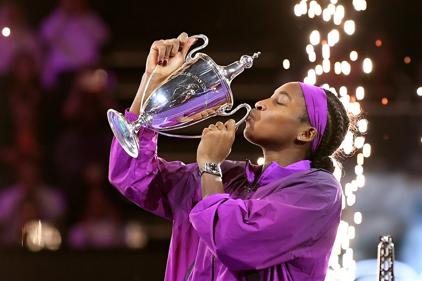 FILE - United States' Coco Gauff kisses the trophy after defeating China's Qinwen Zheng in their women's singles final match of the WTA finals in Riyadh, Saudi Arabia, Saturday, Nov. 9, 2024. (AP Photo/File)