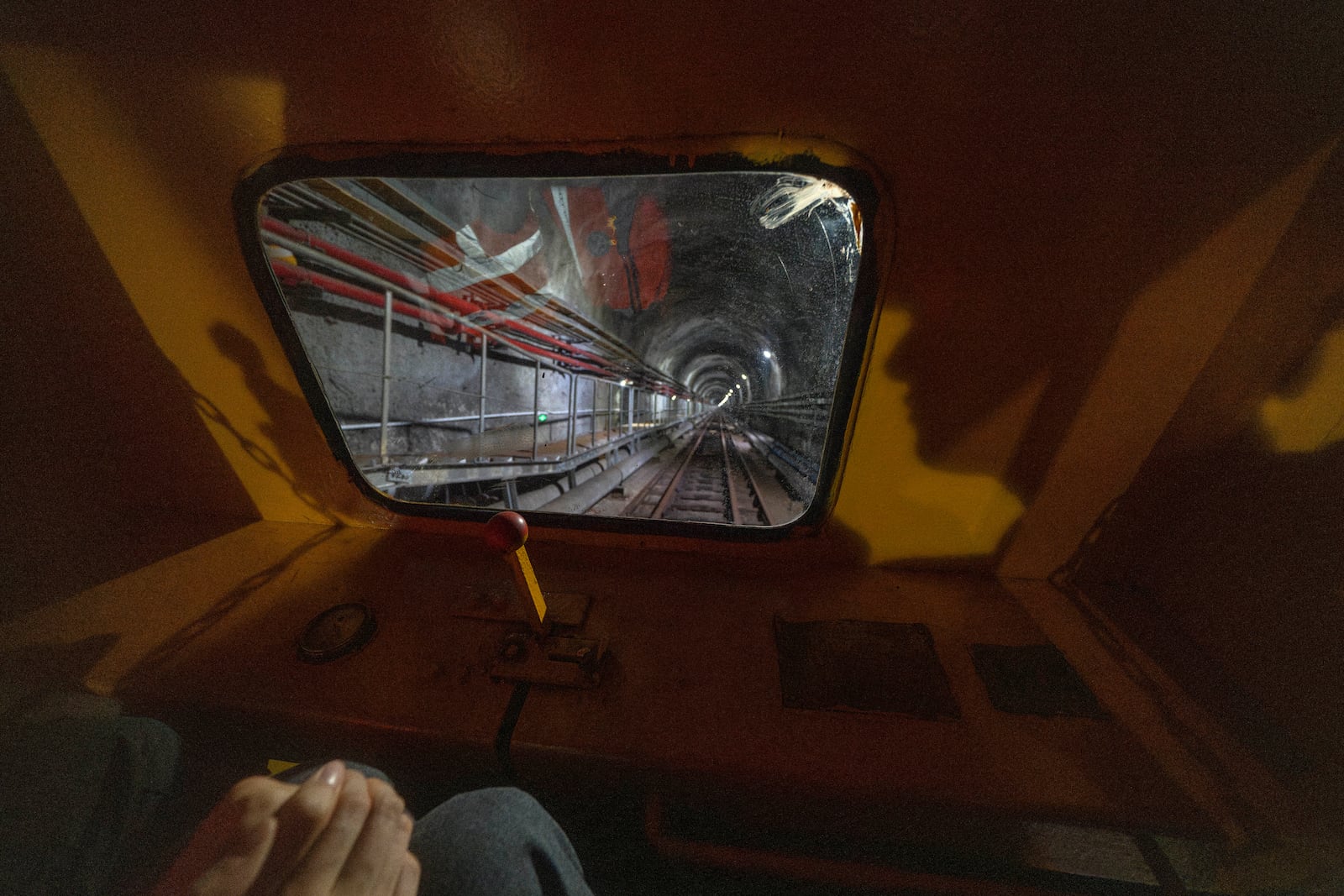 Visitors take a train ride to visit the cosmic detector located 2297 feet (700 meters) underground at the Jiangmen Underground Neutrino Observatory in Kaiping, southern China's Guangdong province on Friday, Oct. 11, 2024. (AP Photo/Ng Han Guan)