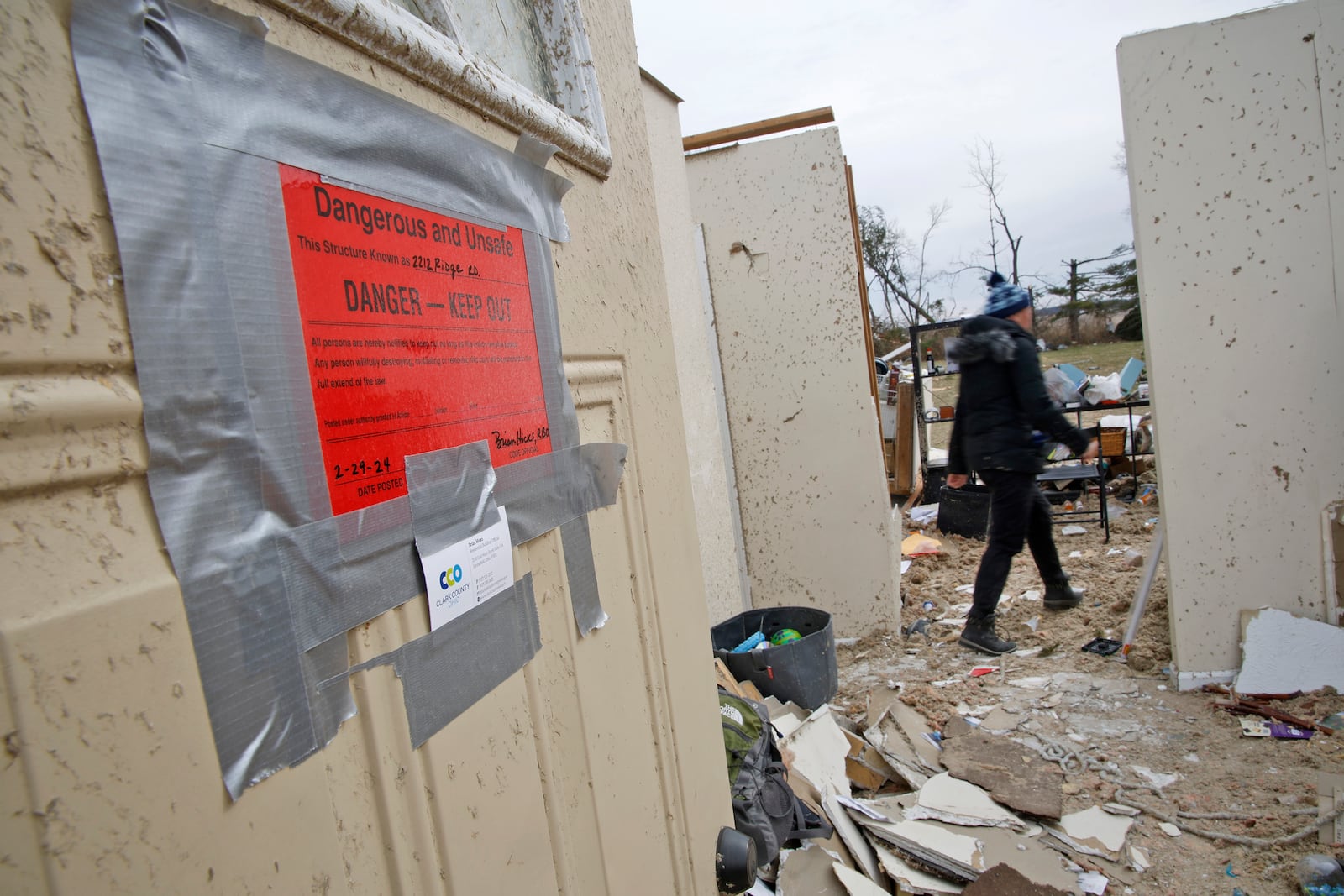 Emi Campbell and her family collect the belongings Friday, March 1, 2024 as they prepare to move out the their Ridge Road house that was destroyed in Wednesday's tornado. BILL LACKEY/STAFF