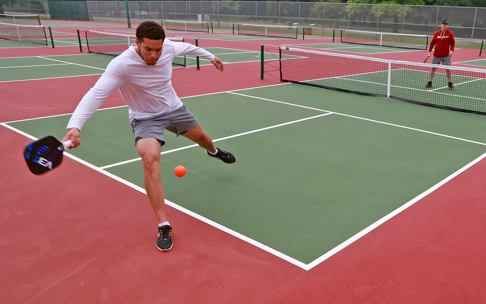 Chad Younts Jr. plays pickleball against his father Chad Yonts Sr. on Tuesday, June 27, 2023 on the new Snyder Park Pickleball and Tennis Courts. BILL LACKEY/STAFF