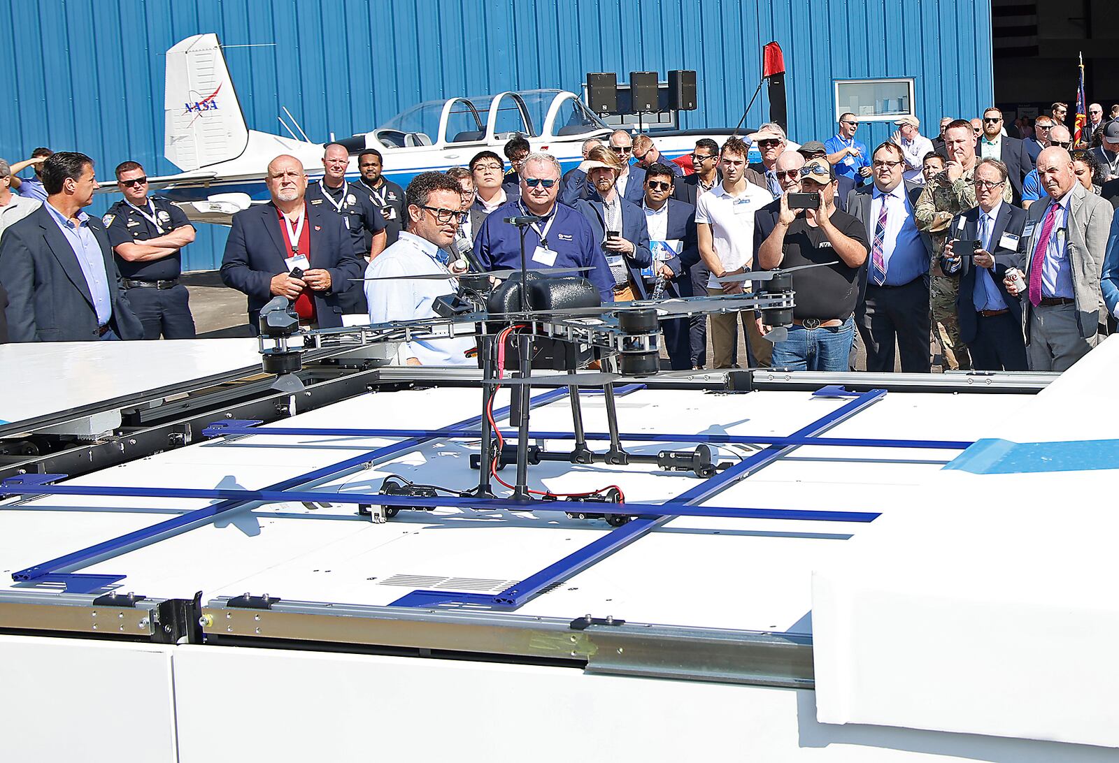 Guests at the National Advanced Air Mobility Forum watch a demonstration from the STRIX Drones company Monday, Sept. 18, 2023. BILL LACKEY/STAFF