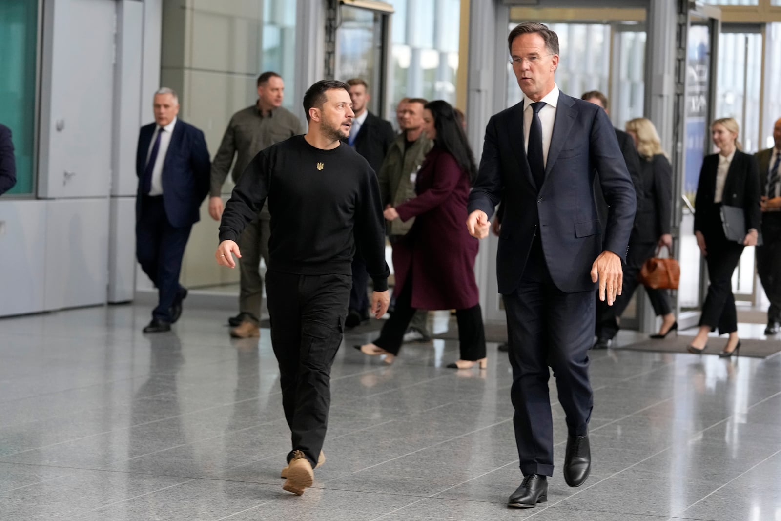 NATO Secretary General Mark Rutte, right, walks with Ukraine's President Volodymyr Zelenskyy prior to a media conference at NATO headquarters in Brussels, Thursday, Oct. 17, 2024. (AP Photo/Virginia Mayo)