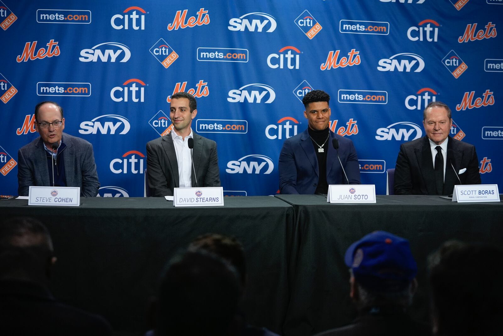 New York Mets owner Steven Cohen, left, speaks as, from second left, Mets president of baseball operations David Stearns, new Mets player Juan Soto, and sports agent Scott Boras, right, listen during a news conference, Thursday, Dec. 12, 2024, in New York. (AP Photo/Frank Franklin II)