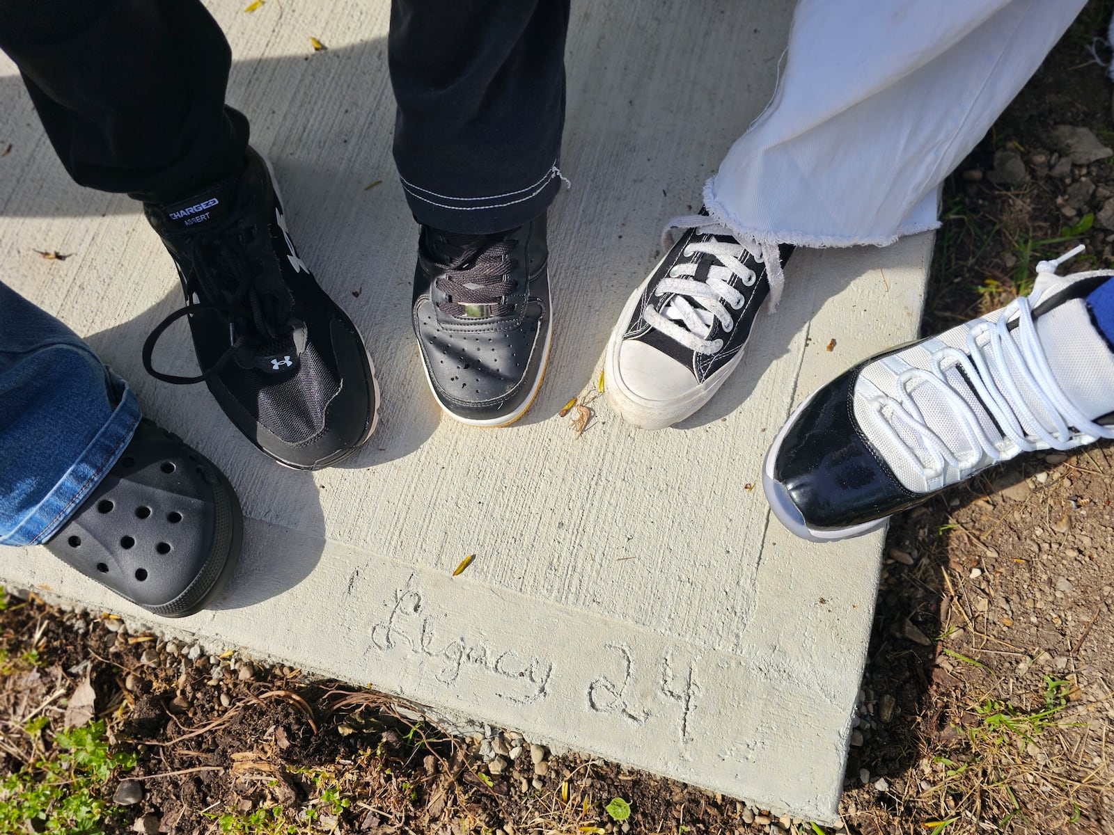 Springfield High School is in the process of putting together some type of shelter house on the bike trail near the school. Last week, students took this picture at the slab, which has "Legacy 24" carved into the concrete. Contributed