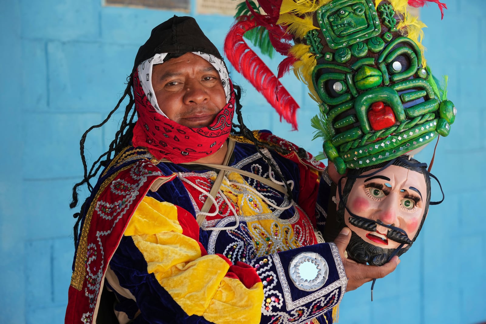 Freddy De Leon poses for a portrait in his Prince Tecun Uman costume before performing the Dance of the Conquest of Guatemala on the feast day of the Black Christ of Esquipulas in Tejutla, in Guatemala's San Marcos department, Wednesday, Jan. 15, 2025. (AP Photo/Moises Castillo)