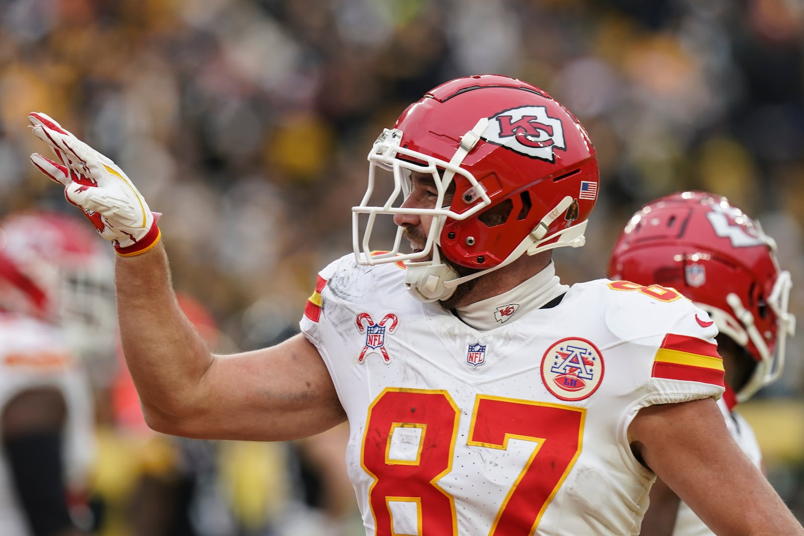 Kansas City Chiefs tight end Travis Kelce (87) celebrates his touchdown against the Pittsburgh Steelers during the second half of an NFL football game, Wednesday, Dec. 25, 2024, in Pittsburgh. (AP Photo/Matt Freed)