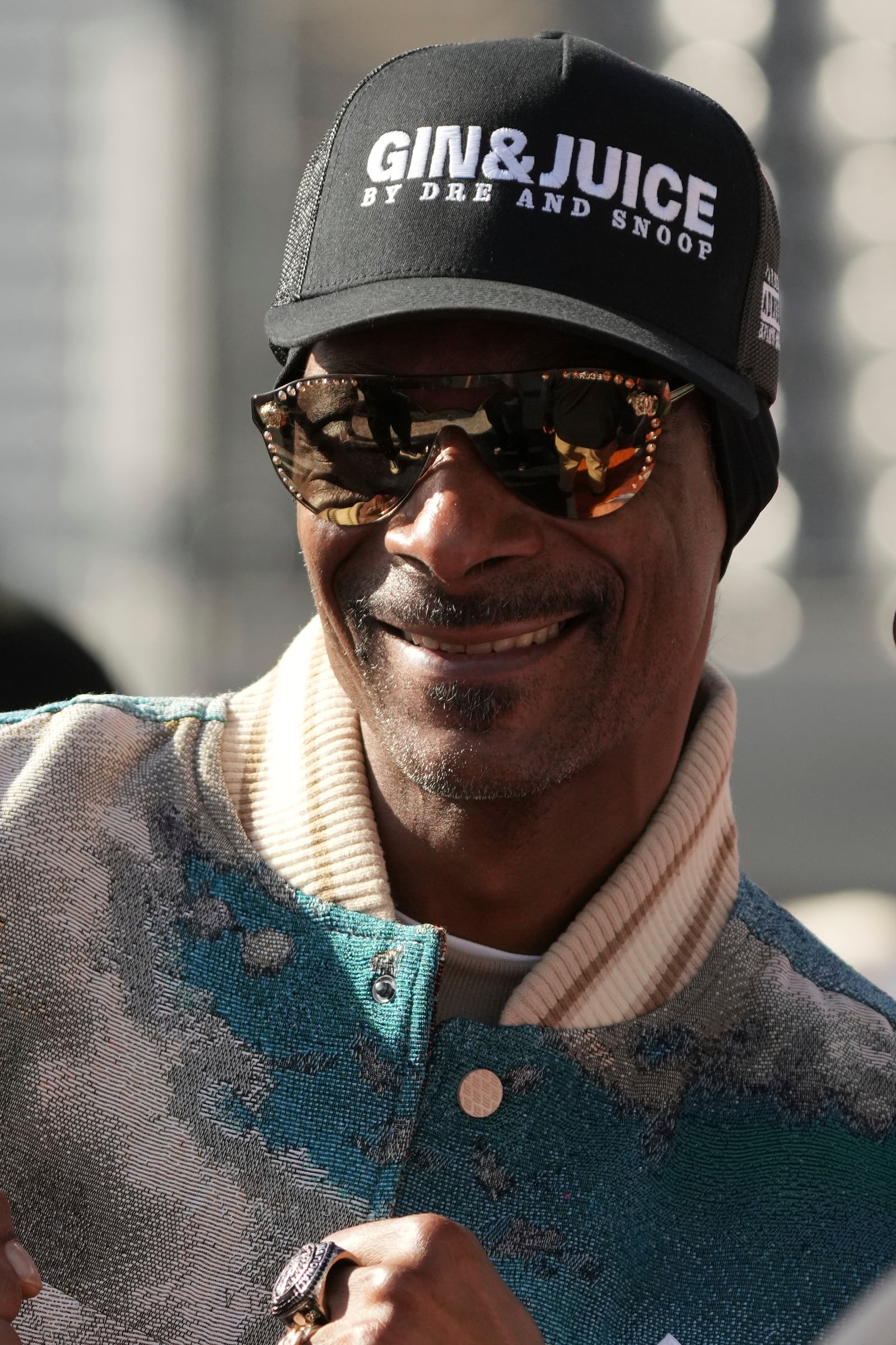 Snoop Dogg makes an appearance before the Arizona Bowl NCAA college football game between Colorado State and Miami (Ohio), Saturday, Dec. 28, 2024, in Tucson, Ariz.