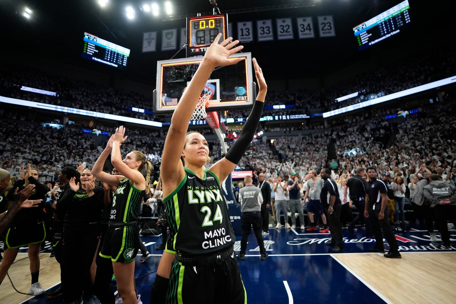 Minnesota Lynx forward Napheesa Collier (24) celebrates their victory over the New York Liberty after Game 4 of a WNBA basketball final playoff series, Friday, Oct. 18, 2024, in Minneapolis. The Lynx won 82-80, forcing a Game 5 in the series. (AP Photo/Abbie Parr)