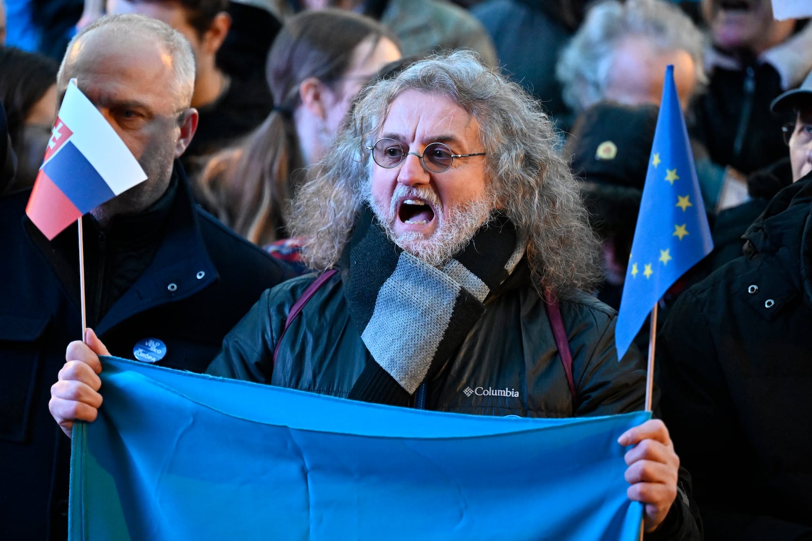 A protester shouts as thousands gather to oppose the policies of Slovakia's Prime Minister Robert Fico in Bratislava, Slovakia, Friday, Jan. 24, 2025. (AP Photo/Denes Erdos)