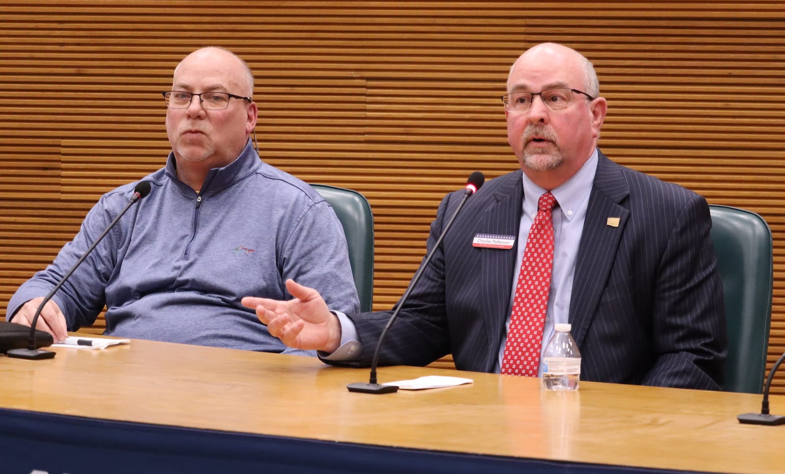 Former Clark County Health Commissioner Charlie Patterson (right) speaks to voters as a county commission candidate as candidate Dave Marshall looks on at a primary debate Monday, Feb. 12, 2024. JESSICA OROZCO/STAFF