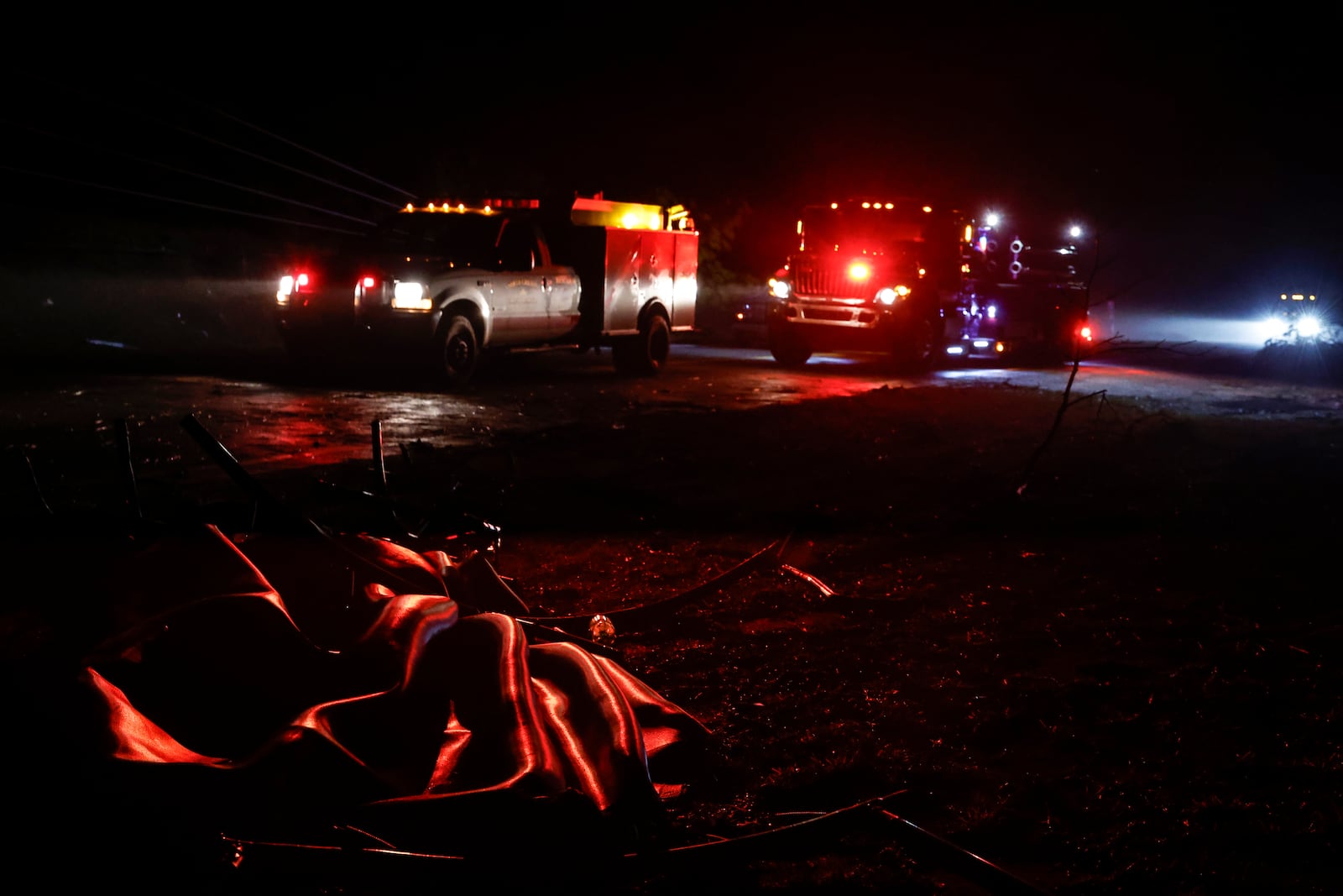 Downed trees and power lines block a road along Highway 82 after a tornado passed through, Sunday, March 16, 2025, in Maplesville, Ala. (AP Photo/Butch Dill)