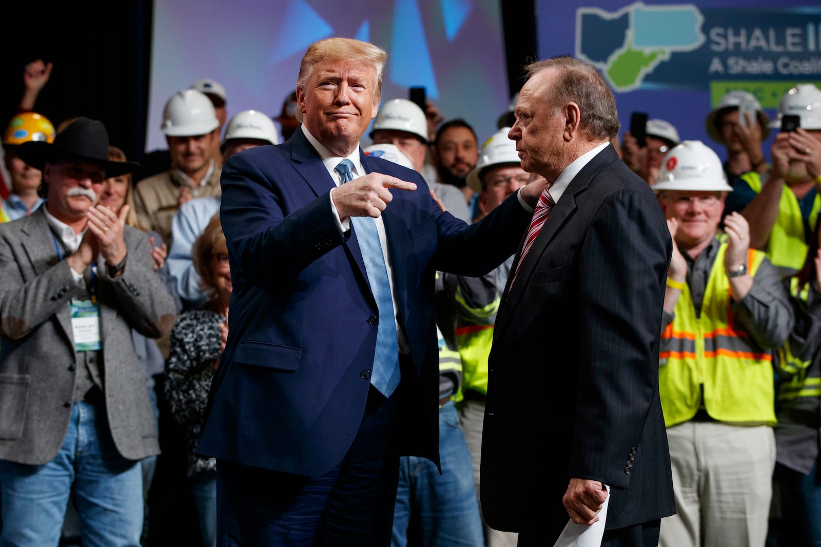 FILE - President Donald Trump points to Continental Resources CEO Harold Hamm as he arrives to speaks to the 9th annual Shale Insight Conference at the David L. Lawrence Convention Center, Wednesday, Oct. 23, 2019, in Pittsburgh. (AP Photo/Evan Vucci, File)