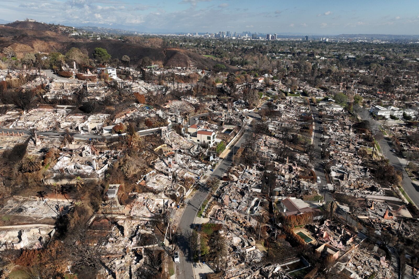 An aerial view shows the devastation left by the Palisades Fire in the Pacific Palisades section of Los Angeles, Monday, Jan. 27, 2025. (AP Photo/Jae C. Hong)