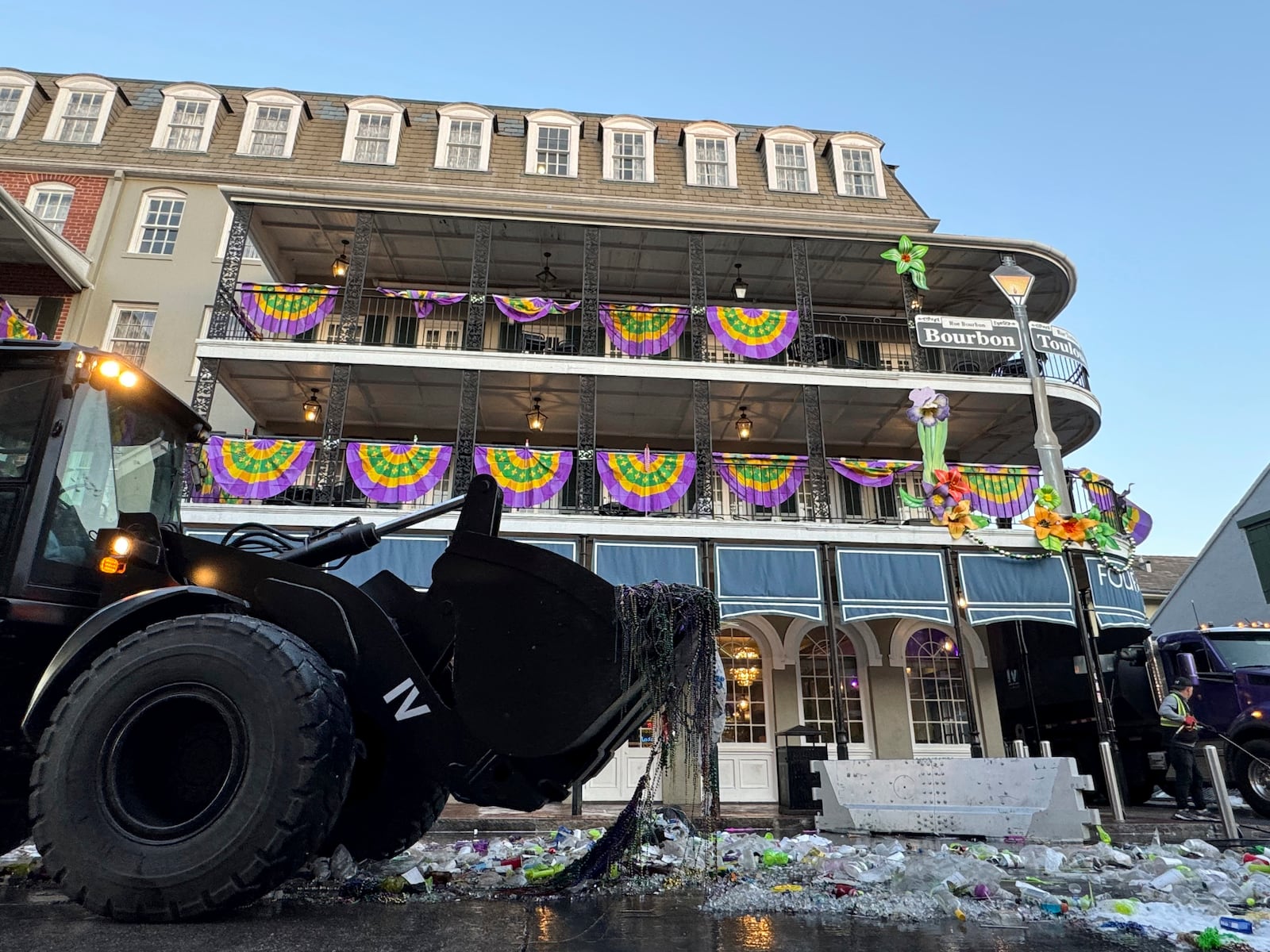 A trash collecting machine operated by IV Waste, the company tasked with cleaning up with the French Quarter in New Orleans, Wednesday, March 5, 2025, gathers detritus the day after Fat Tuesday. (AP Photo/Jack Brook)