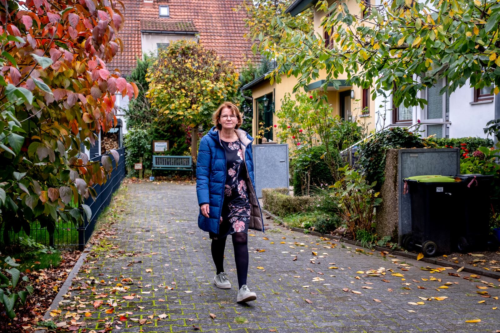 Claudia Huth walks in front of her house in Egelsbach, Germany, Thursday, Oct. 31, 2024. (AP Photo/Michael Probst)