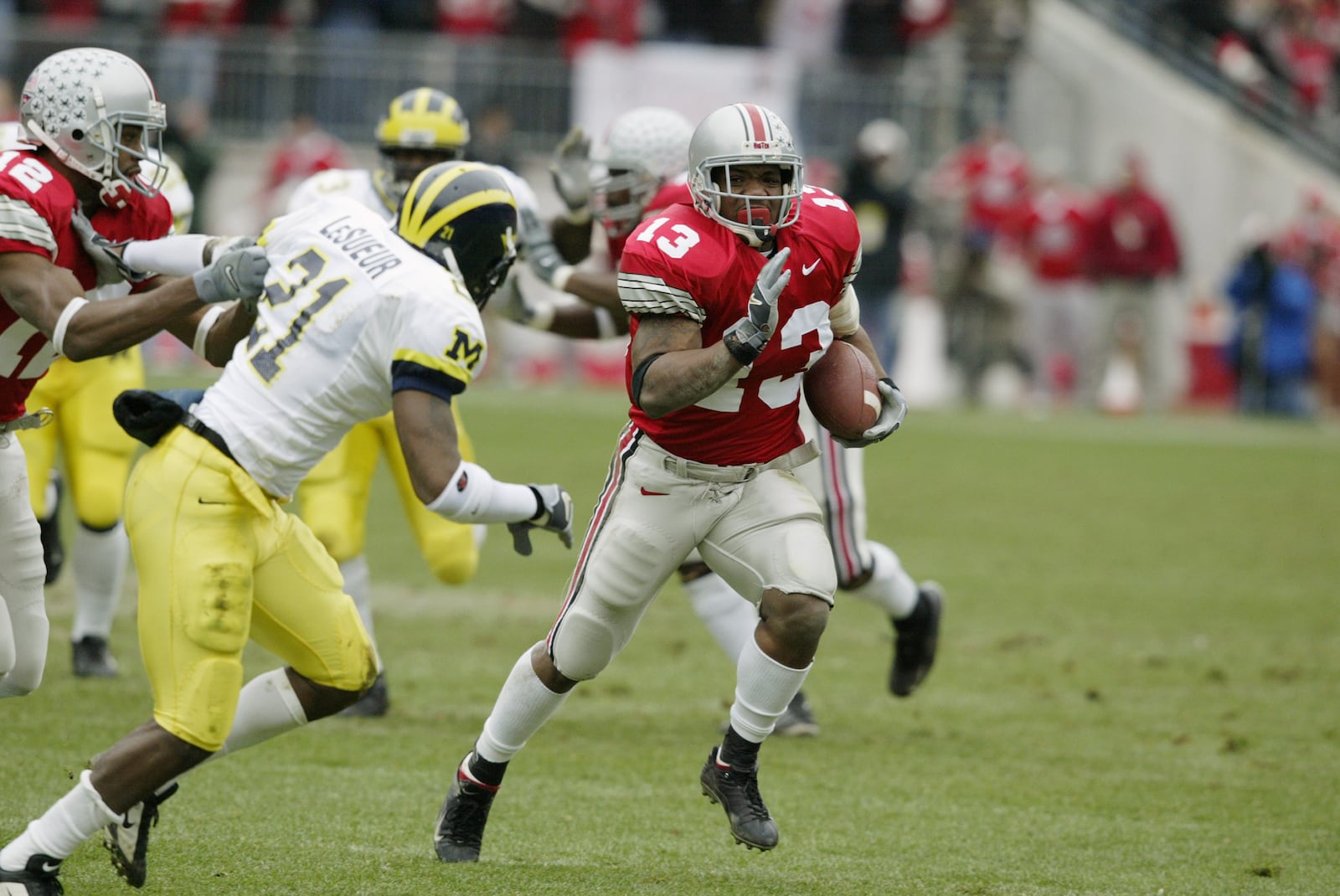 COLUMBUS- NOVEMBER 23:  Maurice Clarett #13 of Ohio State runs against Michigan on November 23, 2002 at Ohio Stadium in Columbus, Ohio.  Ohio State won the game  14-9.  (Photo by Tom Pidgeon/Getty Images)