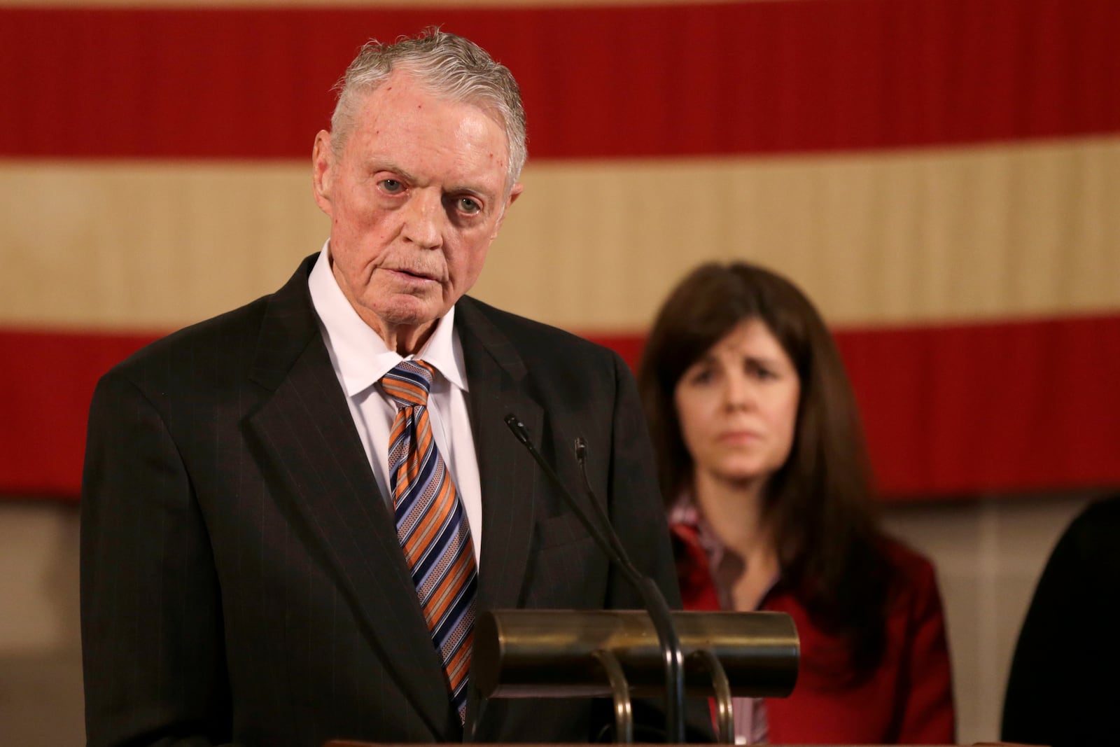 FILE - Former Nebraska football coach Tom Osborne speaks against legalization of medical marijuana, in front of Mary Hilton, mother of an epileptic child, during a news conference at the Governor's office in Lincoln, Neb., Jan. 25, 2019. (AP Photo/Nati Harnik, File)