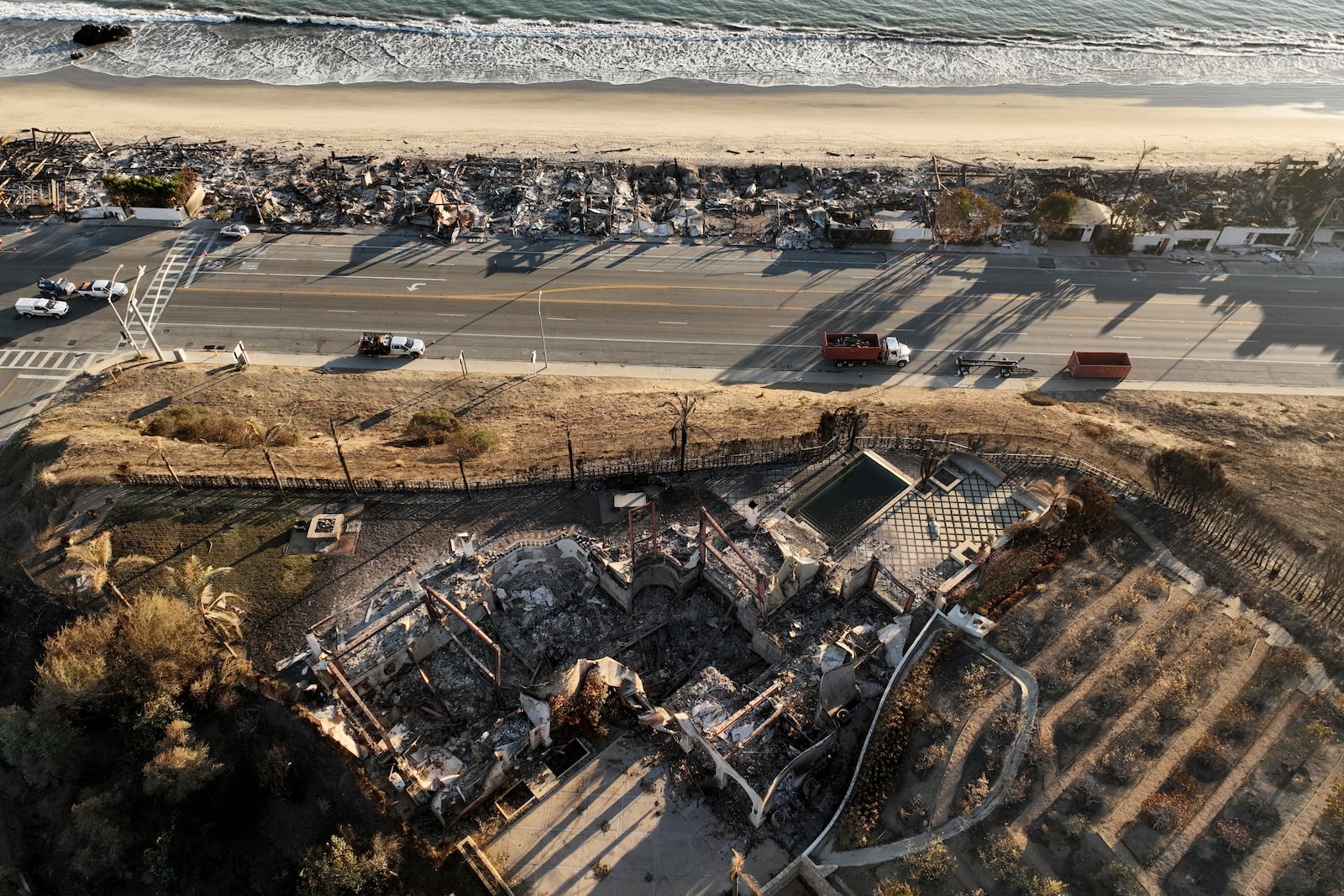 An aerial view shows the devastation by the Palisades Fire Thursday, Jan. 16, 2025 in Malibu, Calif. (AP Photo/Jae C. Hong)