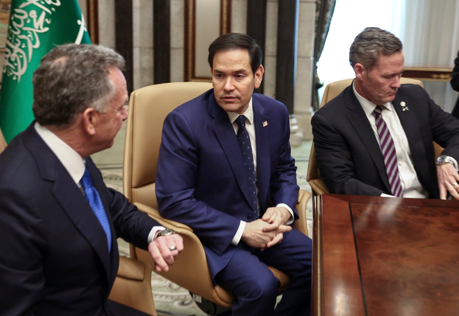 U.S. Secretary of State Marco Rubio, U.S. National Security Advisor Mike Waltz, and U.S. Middle East envoy Steve Witkoff wait to be interviewed after meeting with Russian Foreign Minister Sergei Lavrov and Russian President Vladimir Putin's foreign policy advisor Yuri Ushakov, at Diriyah Palace, in Riyadh, Saudi Arabia, Tuesday, Feb. 18, 2025. (Evelyn Hockstein/Pool Photo via AP)