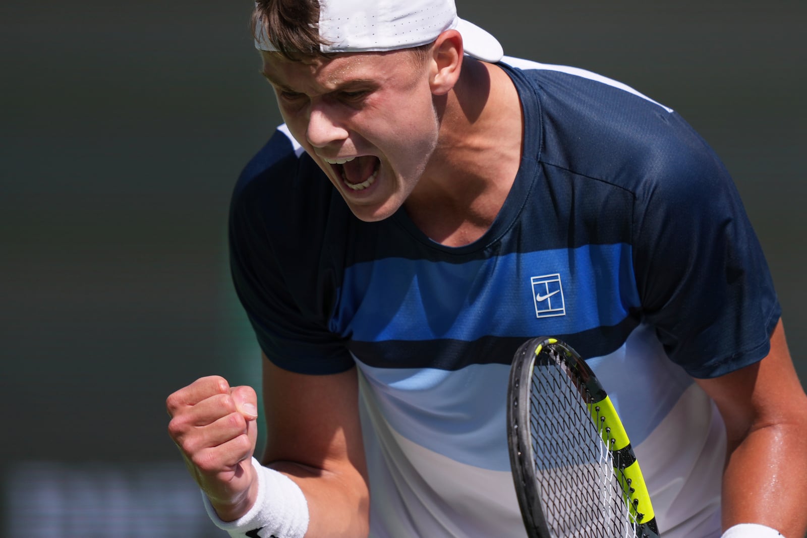 Holger Rune, of Denmark, celebrates a point against Daniil Medvedev, of Russia, during their semifinals match at the BNP Paribas Open tennis tournament Saturday, March 15, 2025, in Indian Wells, Calif. (AP Photo/Mark J. Terrill)