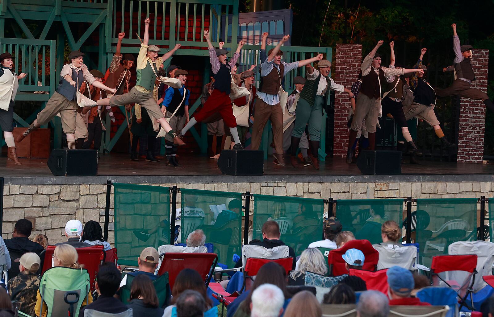 The cast of Disney's Newsies JR. perform a musical number Wednesday, June 14, 2023 during the opening night of the Summer Arts Festival at Veterans Park. BILL LACKEY/STAFF