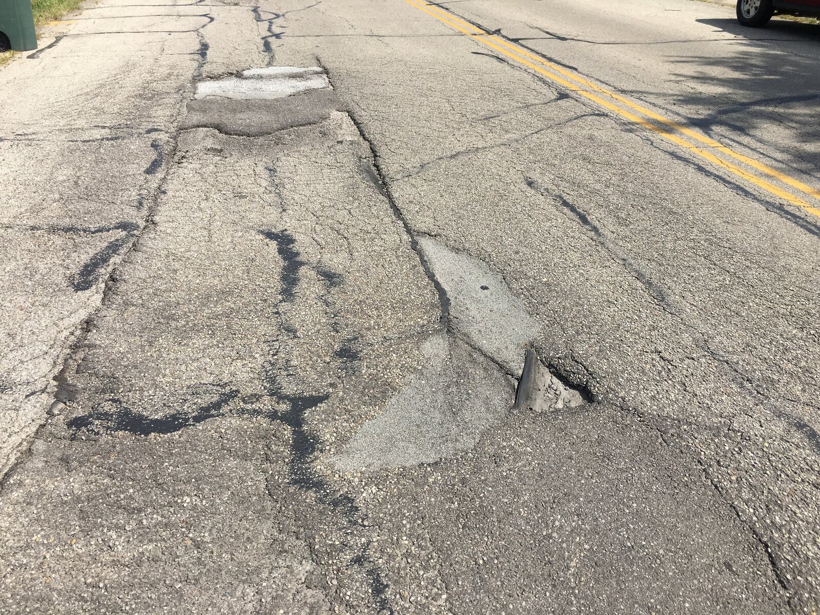 This section of Derby Road near Blairwood Ave. in Jefferson Township is in need of repair. Lynn Hulsey/STAFF PHOTO