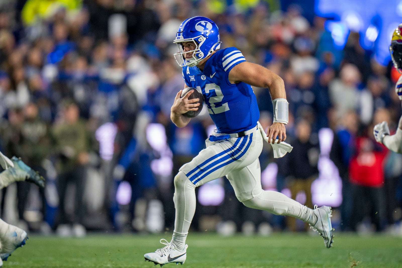 BYU quarterback Jake Retzlaff runs on a quarterback keeper, during the first half of an NCAA college football game Saturday, Nov. 16, 2024, in Provo. (AP Photo/Rick Egan)