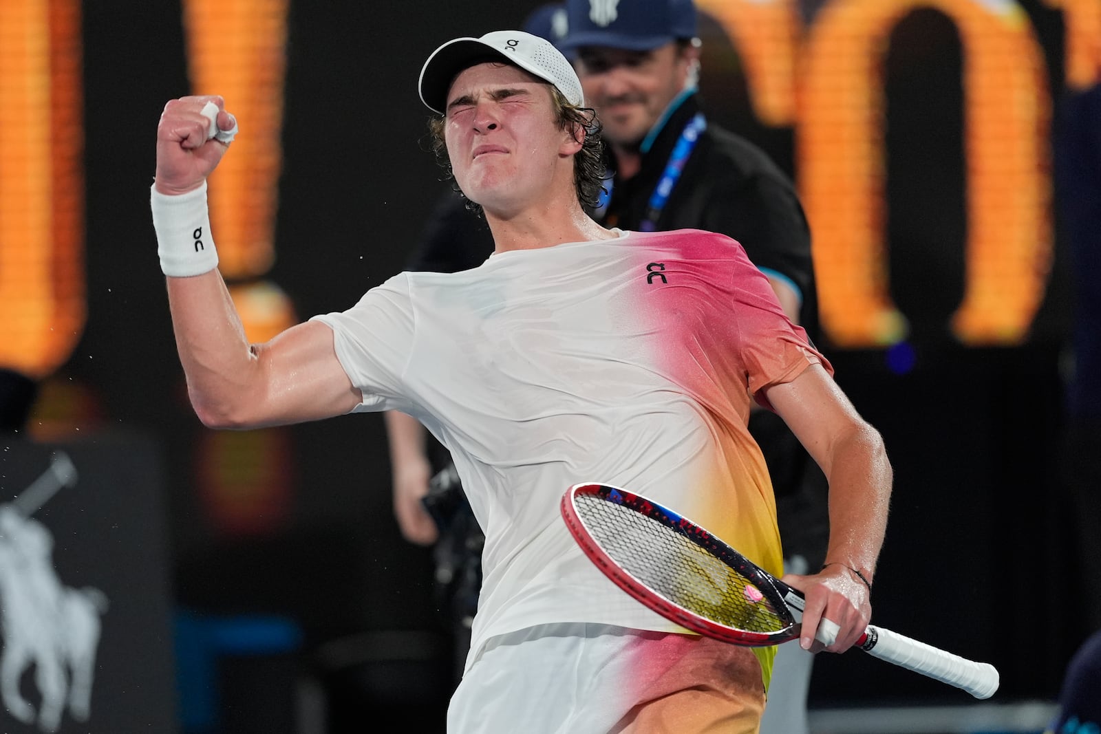 Joao Fonseca of Brazil celebrates after defeating Andrey Rublev of Russia in their first round match at the Australian Open tennis championship in Melbourne, Australia, Tuesday, Jan. 14, 2025. (AP Photo/Asanka Brendon Ratnayake)