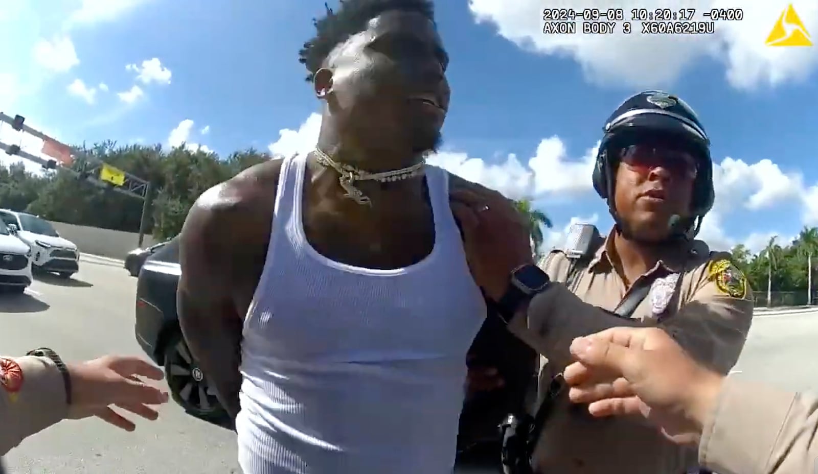 FILE - This body cam image released by the Miami-Dade Police Department shows Miami Dolphins receiver Tyreek Hill being arrested during a traffic stop, Sunday, Sept. 8, 2024. (Miami-Dade Police Department via AP, File)