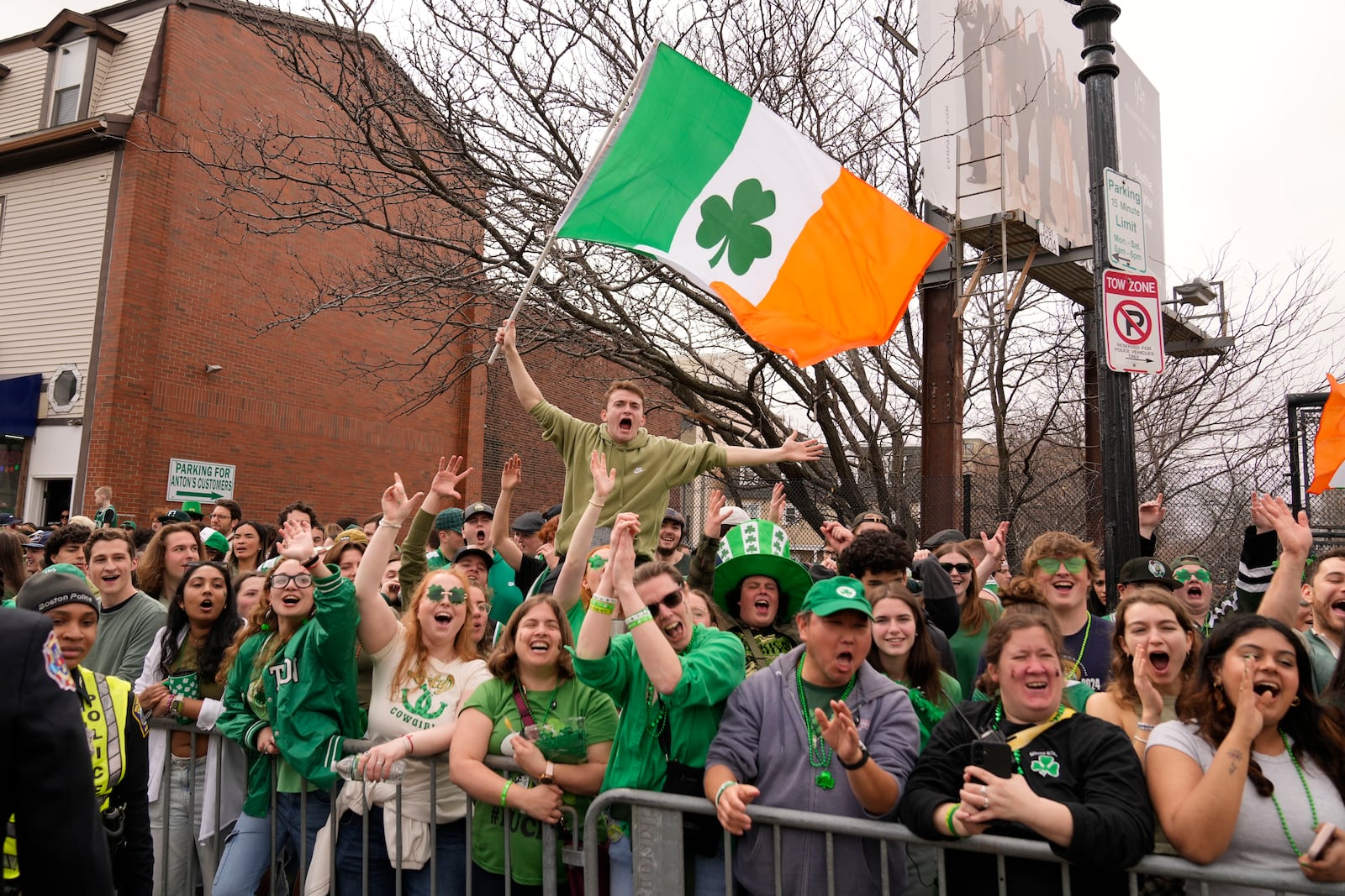 Spectators cheer at the St. Patrick's Day parade, Sunday, March 16, 2025, in Boston, Mass. (AP Photo/Robert F. Bukaty)