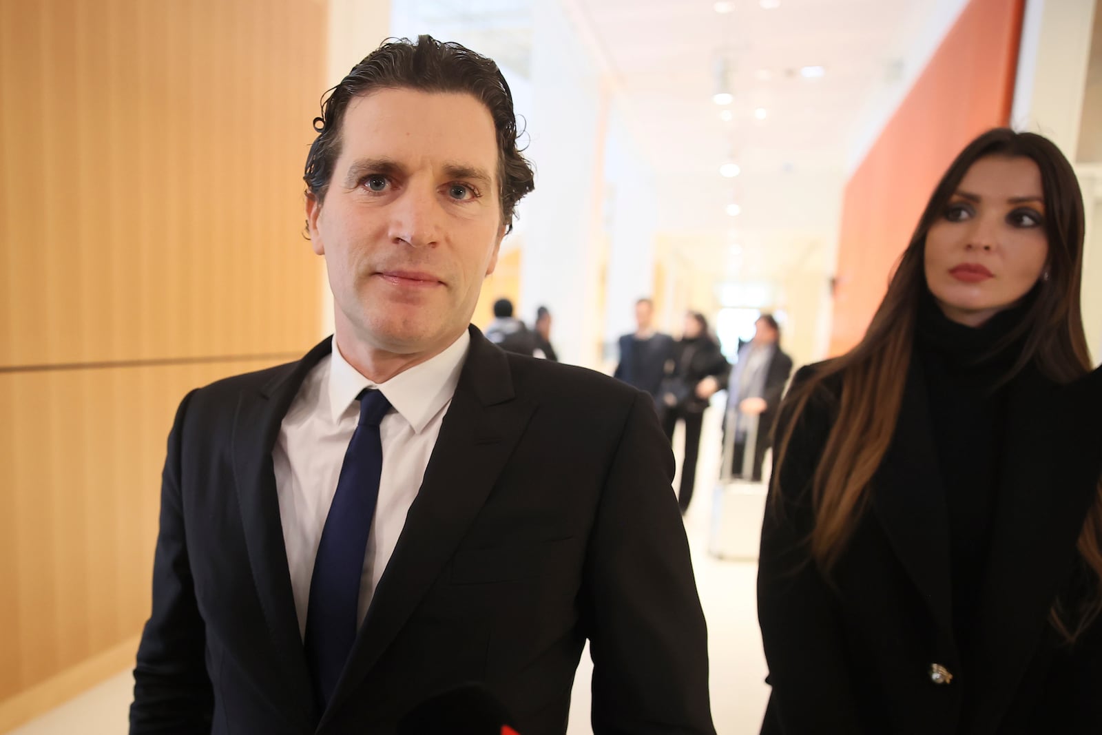 Jeremie Assous, left, the lawyer for French actor Gerard Depardieu, arrives at the courtroom while Depardieu, who is facing trial for the alleged sexual assaults of two women on a film set in 2021, won't appear before a criminal court, Monday, Oct. 28, 2024 in Paris. (AP Photo/Thomas Padilla)