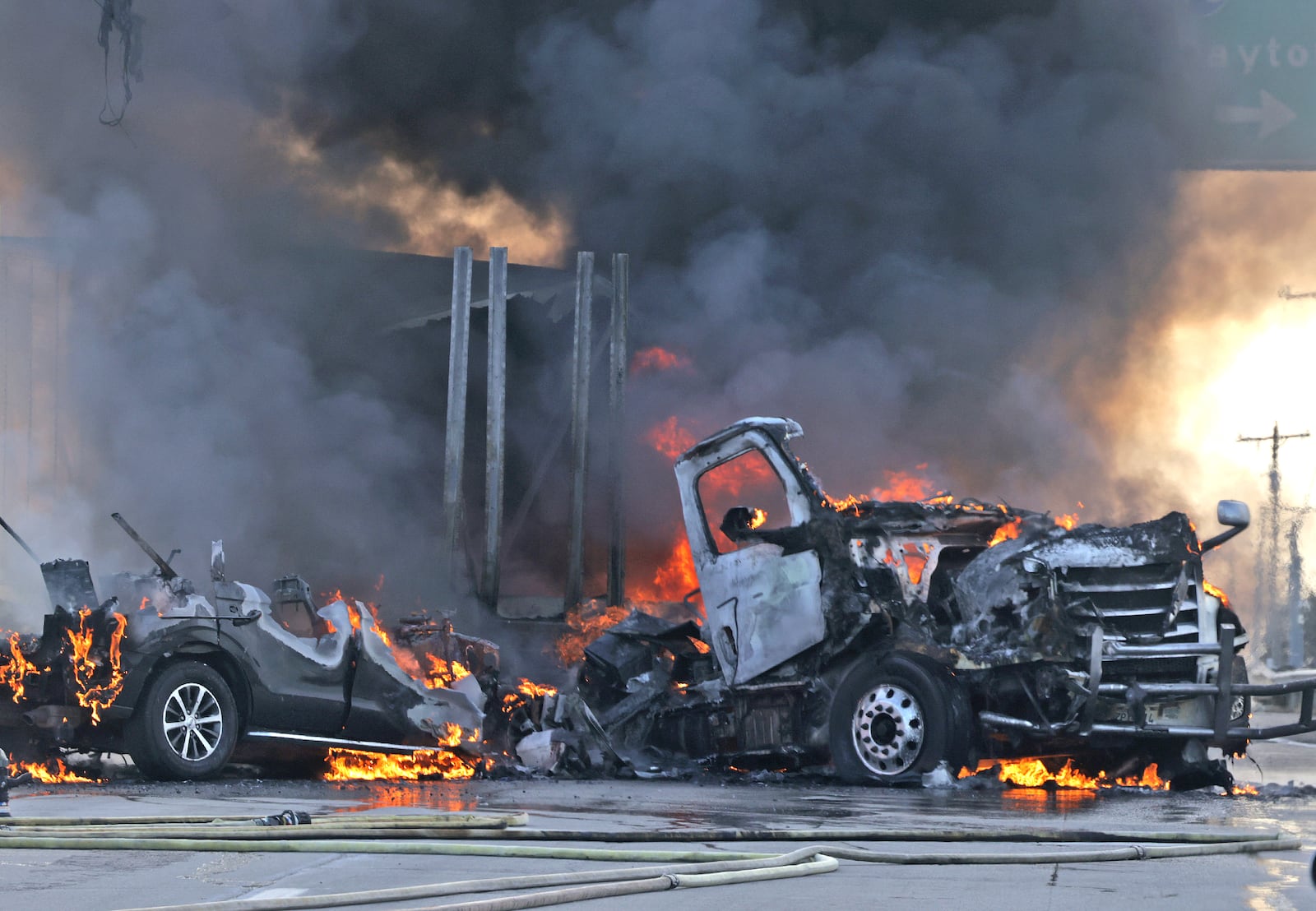 A semi truck and an SUV burst into flames after colliding on State Route 41 at the I-70 overpass Friday, Feb. 7, 2025. Both occupants escaped with minor injuries. Route 41 was closed for several hours while wreck was cleaned up. BILL LACKEY/STAFF