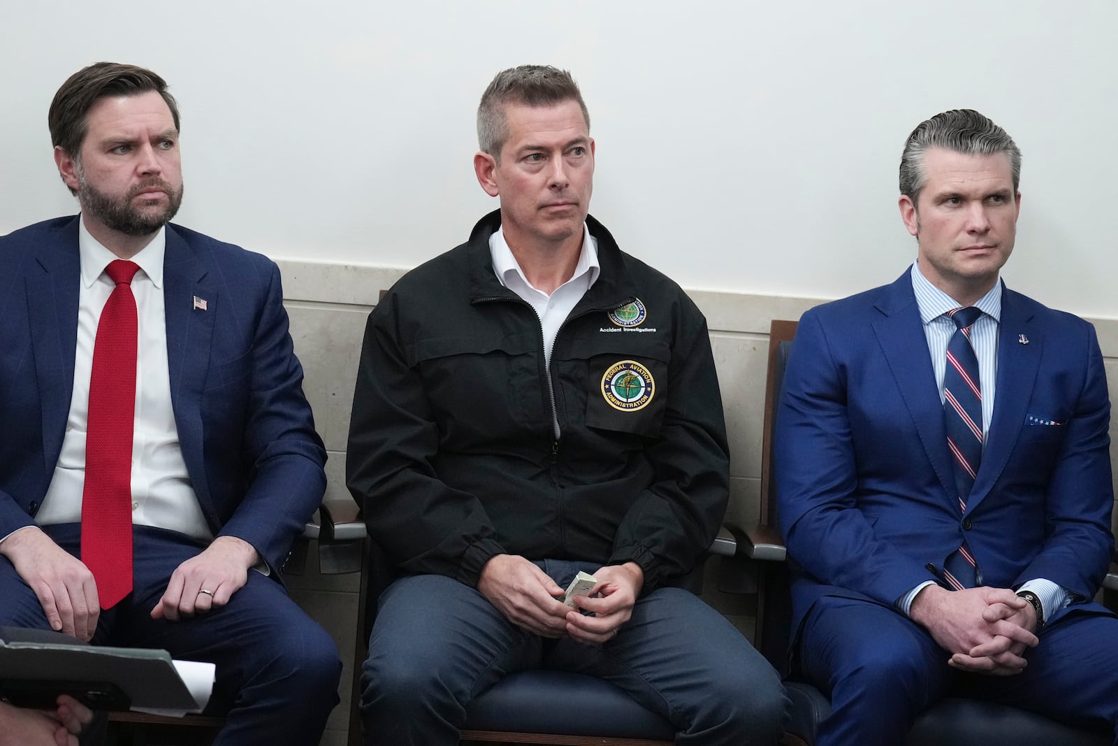 From left, Vice President JD Vance, Transportation Secretary Sean Duffy and Secretary of Defense Pete Hegseth, look on as President Donald Trump speaks in the James Brady Press Briefing Room at the White House, Thursday, Jan. 30, 2025, in Washington. (AP Photo/Jacquelyn Martin)