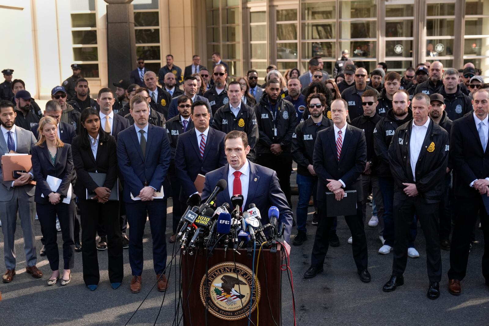 DEA special agent Frank Tarantino II, center front, speaks at a news conference outside the federal courthouse in the Brooklyn borough of New York, Friday, Feb. 28, 2025, following the arraignment of Cartel leaders Rafael Caro Quintero and Vicente Carrillo Fuentes. (AP Photo/Seth Wenig)