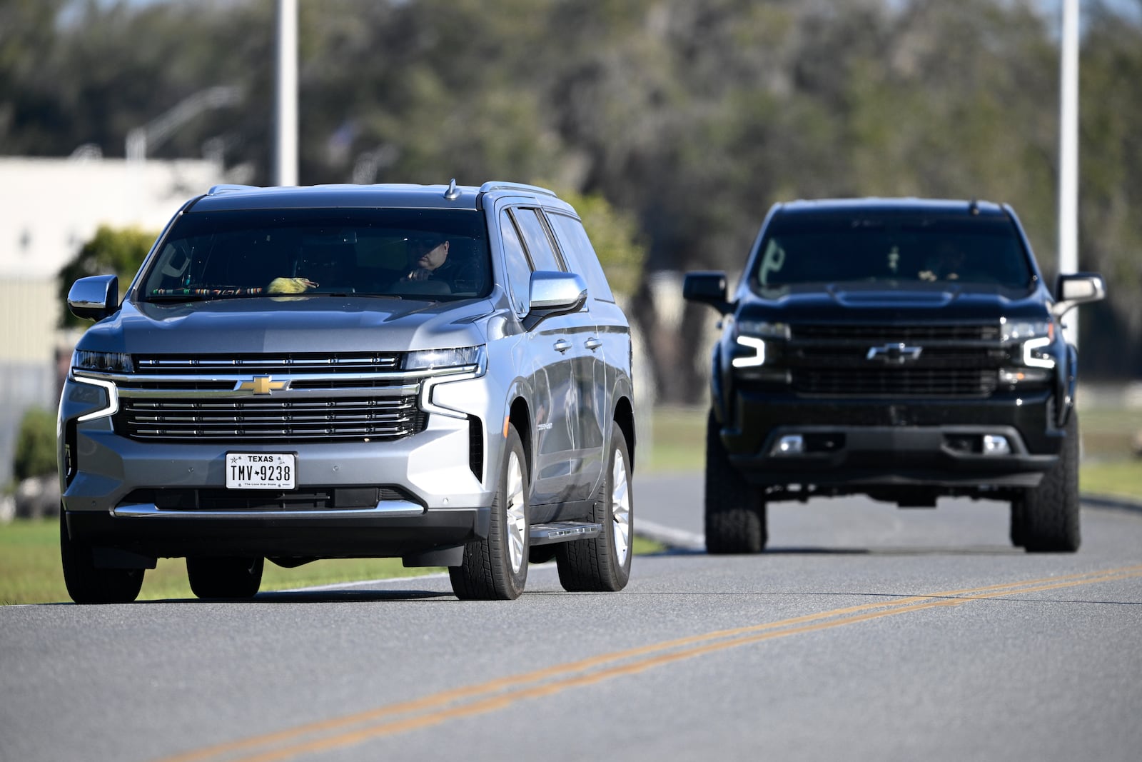 A vehicle carrying Leonard Peltier, front, leaves the Federal Correctional Complex, Coleman, Tuesday, Feb. 18, 2025, in Sumterville, Fla. (AP Photo/Phelan M. Ebenhack)