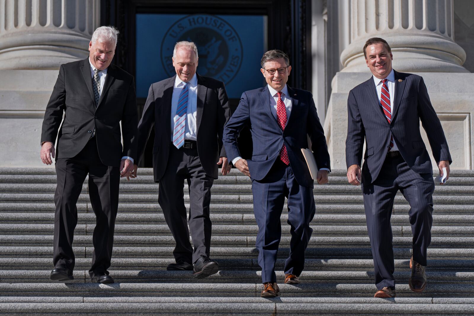 House Republican leaders, from left, Majority Whip Tom Emmer, R-Minn., Majority Leader Steve Scalise, R-La., Speaker of the House Mike Johnson, R-La., and Rep. Richard Hudson, R-N.C., chairman of the National Republican Congressional Committee, arrive to tout Republican wins and meet with reporters on the steps of the Capitol in Washington, Tuesday, Nov. 12, 2024. Congress returns to work this week to begin what is known as a lame-duck session — that period between Election Day and the end of the two-year congressional term. (AP Photo/J. Scott Applewhite)