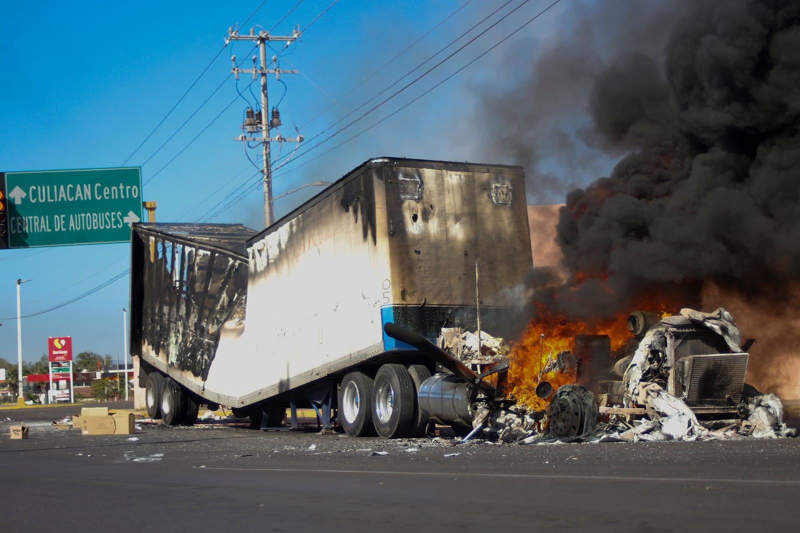 FILE - A truck burns on a street in Culiacan, Sinaloa state, Mexico, Jan. 5, 2023, after Mexican security forces captured Ovidio Guzmán, a son of former Sinaloa cartel boss Joaquín "El Chapo" Guzmán, which set off gunfights and roadblocks. (AP Photo/Martin Urista, File)