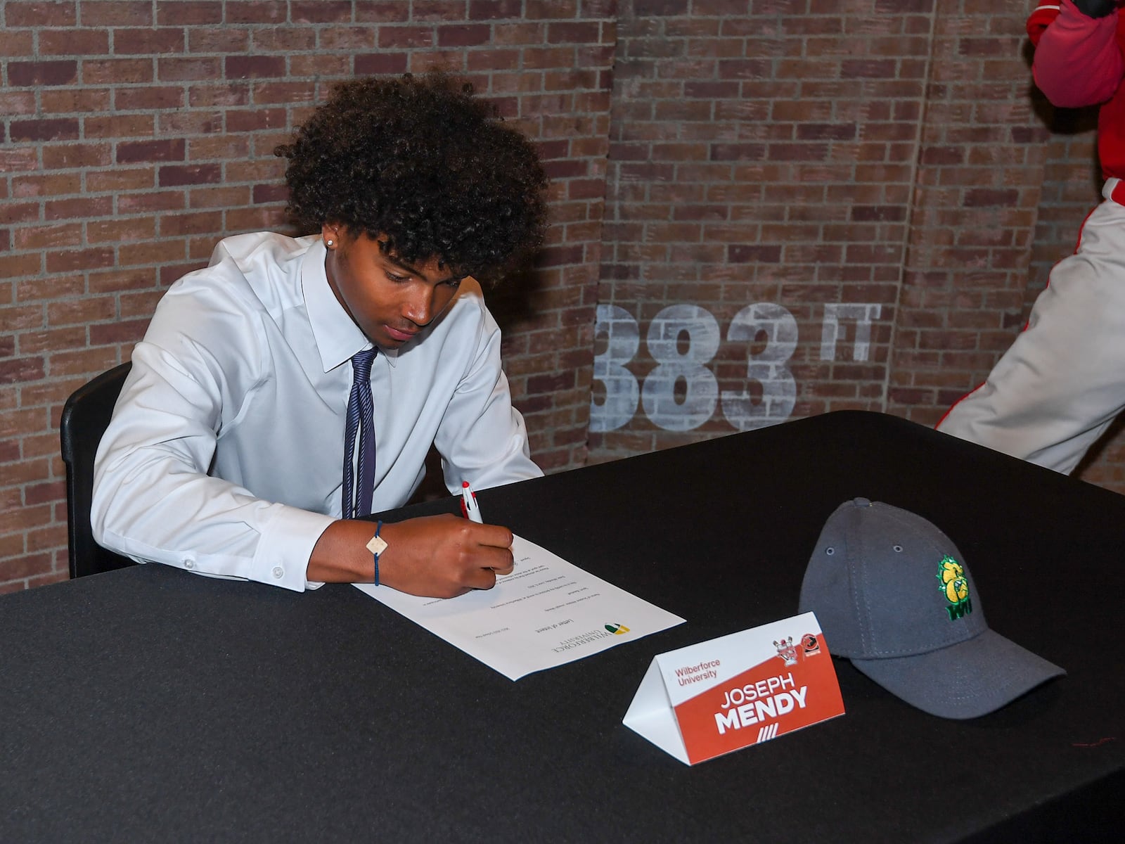 Joe Mendy signs to play baseball at Wilberforce University at a Cincinnati Reds Youth Academy press conference on Monday, June 6, 2022, in Cincinnati. Photo by Emilee Chinn, Cincinnati Reds