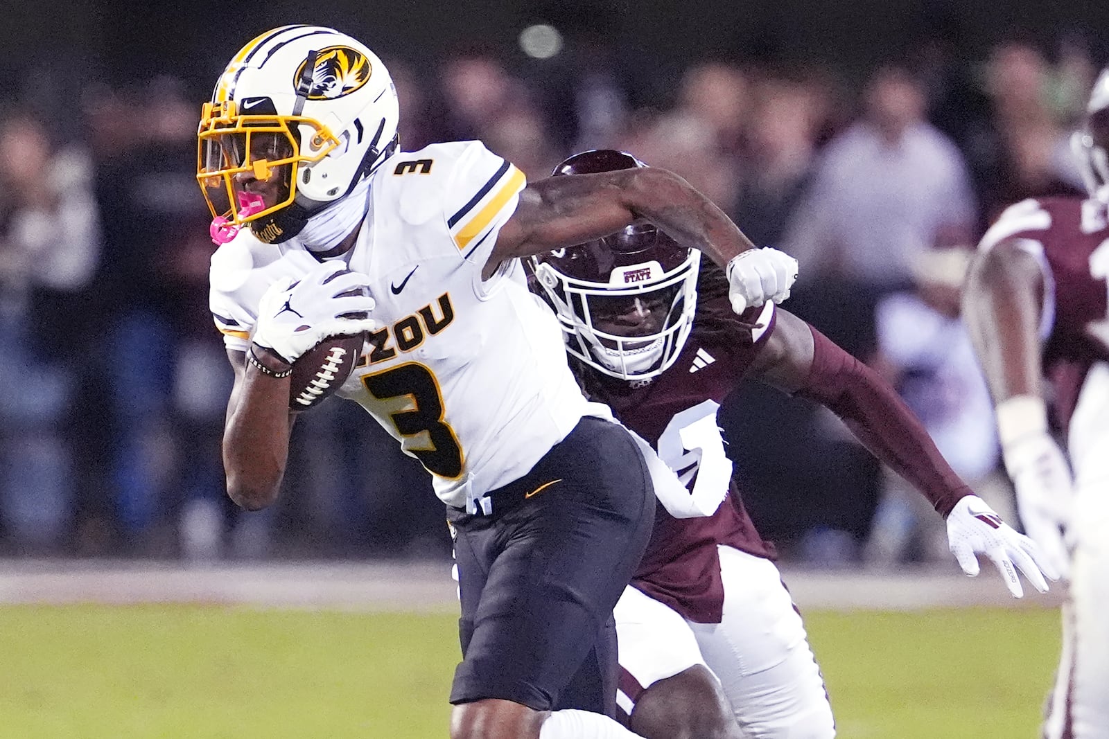 Missouri wide receiver Luther Burden III (3) sprints past a Mississippi State defender with a first down pass reception during the second half of an NCAA college football game, Saturday, Nov. 23, 2024, in Starkville, Miss. (AP Photo/Rogelio V. Solis)