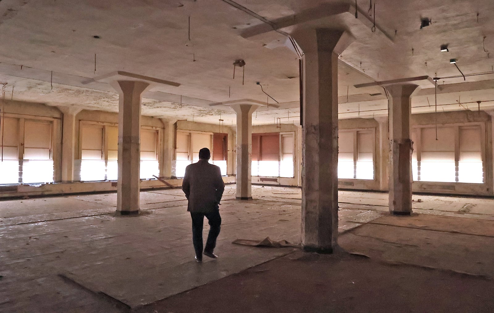 John Landess, executive director of the Turner Foundation, walks through one of the upper floors of the Wren Building in downtown Springfield. BILL LACKEY/STAFF