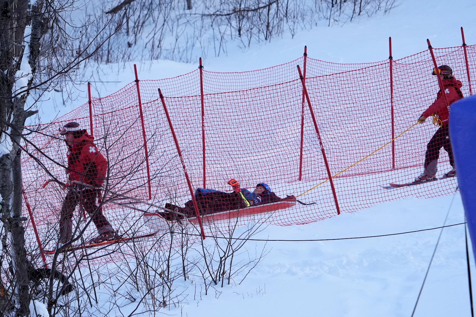 Mikaela Shiffrin, of the United States, is taken down the mountain on a sled by ski patrol after crashing during the second run of a women's World Cup giant slalom skiing race, Saturday, Nov. 30, 2024, in Killington, Vt. (AP Photo/Robert F. Bukaty)