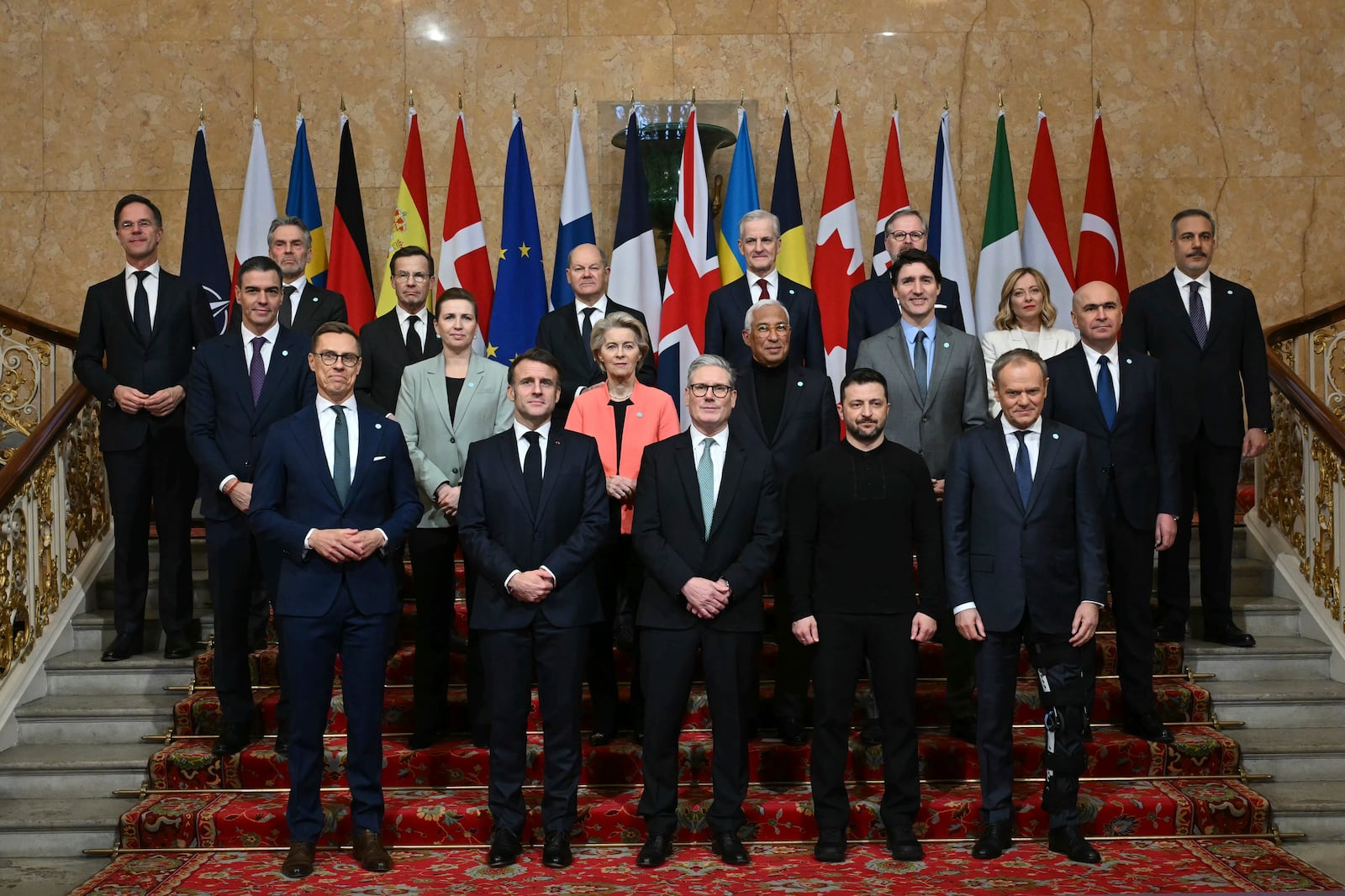 Britain's Prime Minister Keir Starmer, front center, hosts the European leaders' summit to discuss Ukraine, at Lancaster House, London, Sunday March 2, 2025. Front row from left, Finland's President Alexander Stubb, France's President Emmanuel Macron, Britain's Prime Minister Keir Starmer, Ukraine's President Volodymyr Zelenskyy and Poland's Prime Minister Donald Tusk. Center row from left, Spain's Prime Minister Pedro Sanchez, Denmark's Prime Minister Mette Frederiksen, European Commission President Ursula von der Leyen, European Council President Antonio Costa, Canada's Prime Minister Justin Trudeau, and Romania's Interim President Ilie Bolojan. Back row from left, NATO secretary General Mark Rutte, Netherlands' Prime Minister Dick Schoof, Sweden's Prime Minister Ulf Kristersson, Germany's Chancellor Olaf Scholz, Norway's Prime Minister Jonas Gahr Store, Czech Republic's Prime Minister Petr Fiala, Italy's Prime Minister Giorgia Meloni and Turkey's Minister of Foreign Affairs Hakan Fidan. (Justin Tallis/Pool via AP)