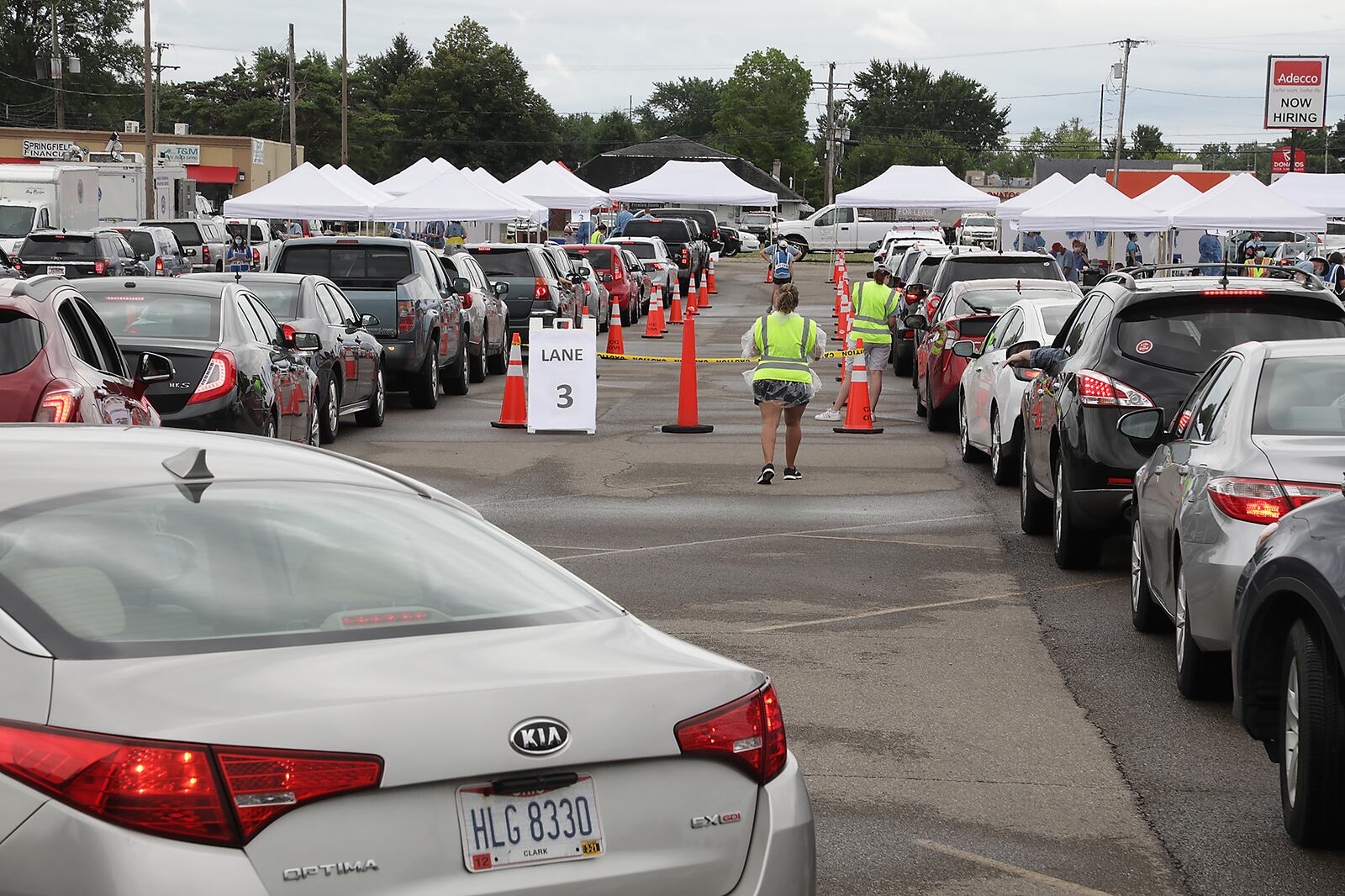 People wait in their cars for a free COVID-19 test on July 22 in the Burnett Plaza parking lot. This was the Clark County Combined Health District's third free clinic but the first time they've held a drive thru clinic. BILL LACKEY/STAFF