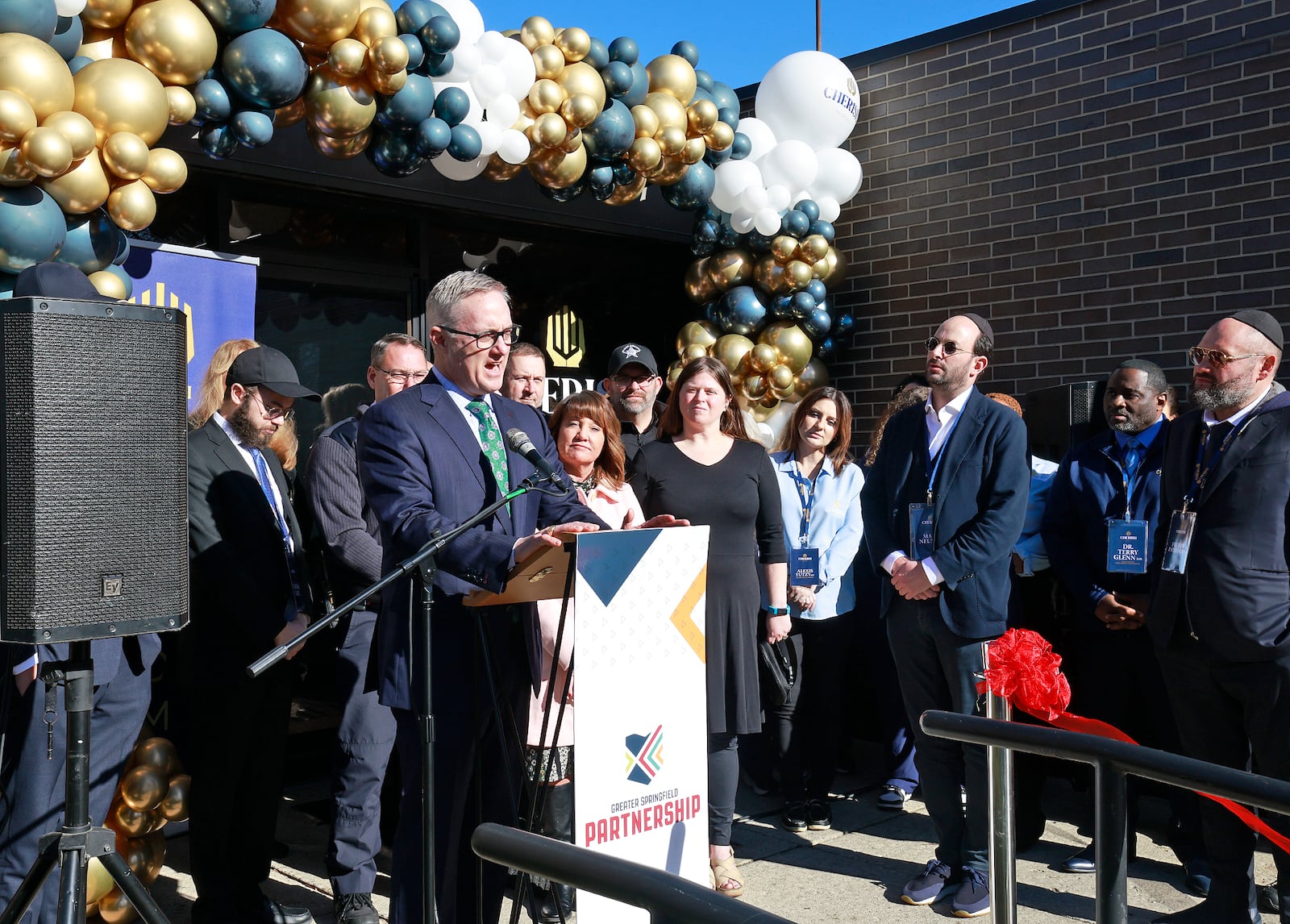 Springfield Mayor Rob Rue talks during a ribbon cutting ceremony for Cherish Hospice's new Ohio headquarters on East High Street Tuesday, Dec. 17, 2024. BILL LACKEY/STAFF