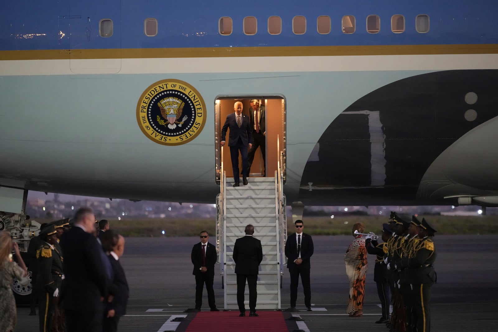 President Joe Biden walks from Air Force One as he arrives at Quatro de Fevereiro international airport in the capital Luanda, Angola on Monday, Dec. 2, 2024, on his long-promised visit to Africa. (AP Photo/Ben Curtis)