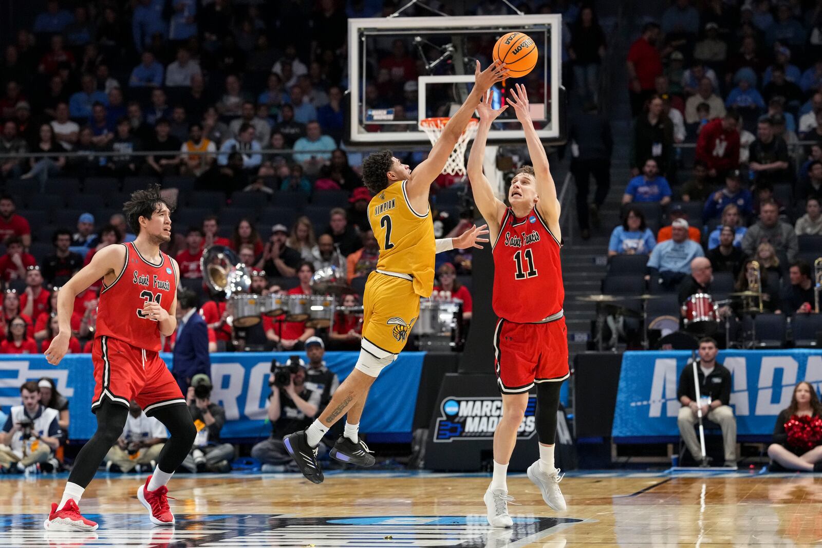 Alabama State guard Micah Simpson (2) makes a steal against Saint Francis guard Riley Parker (11) during the first half of a First Four college basketball game in the NCAA Tournament, Tuesday, March 18, 2025, in Dayton, Ohio. (AP Photo/Jeff Dean)