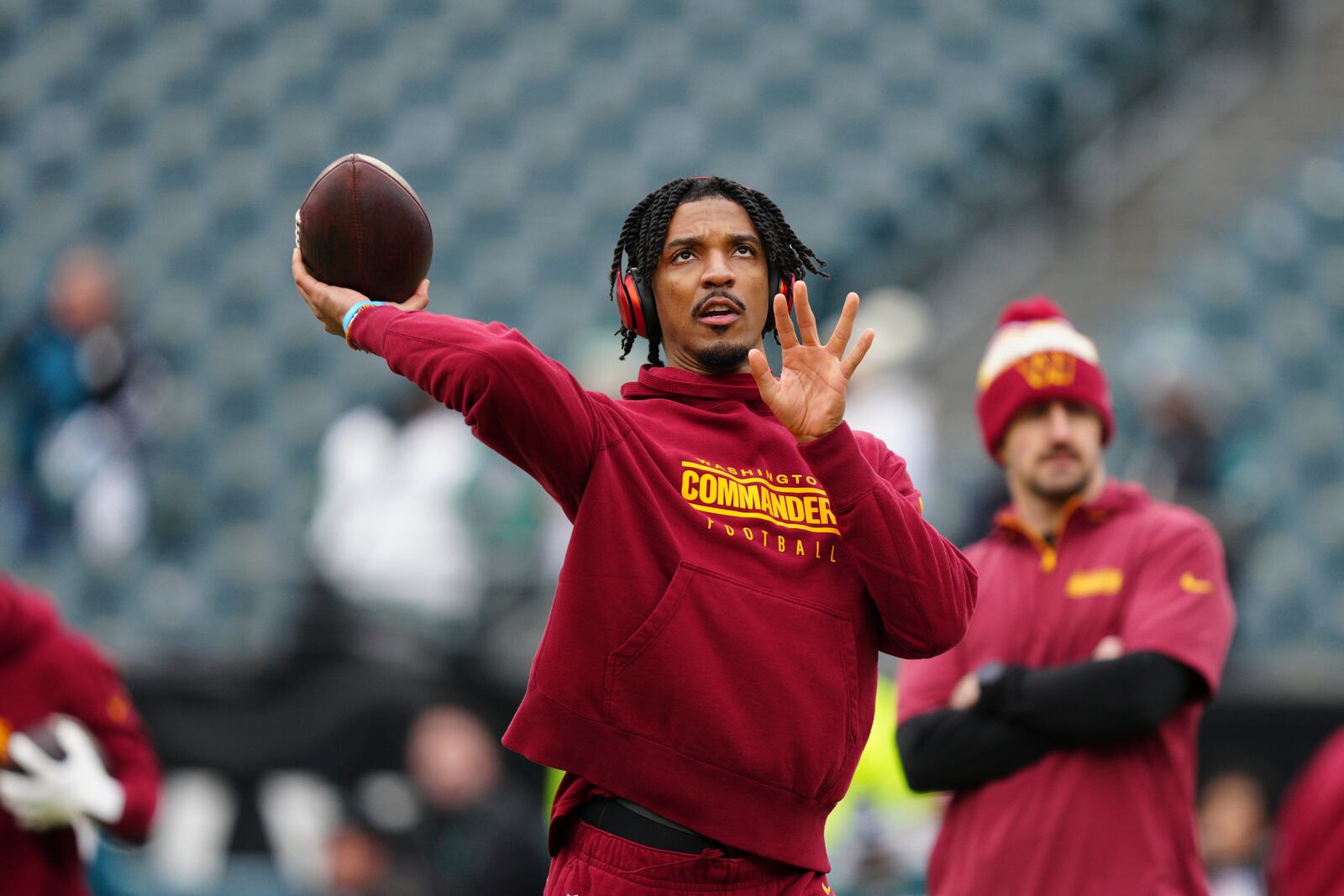 Washington Commanders quarterback Jayden Daniels warms up before the NFC Championship NFL football game against the Philadelphia Eagles, Sunday, Jan. 26, 2025, in Philadelphia. (AP Photo/Derik Hamilton)