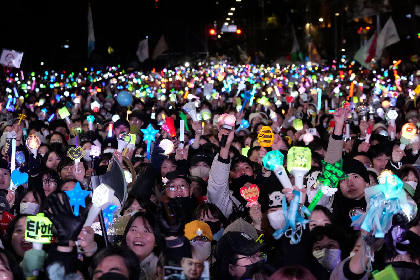 FILE- Participants gather to celebrate after South Korea's parliament voted to impeach President Yoon Suk Yeol outside the National Assembly in Seoul, South Korea, Dec. 14, 2024. (AP Photo/Ahn Young-joon, File)