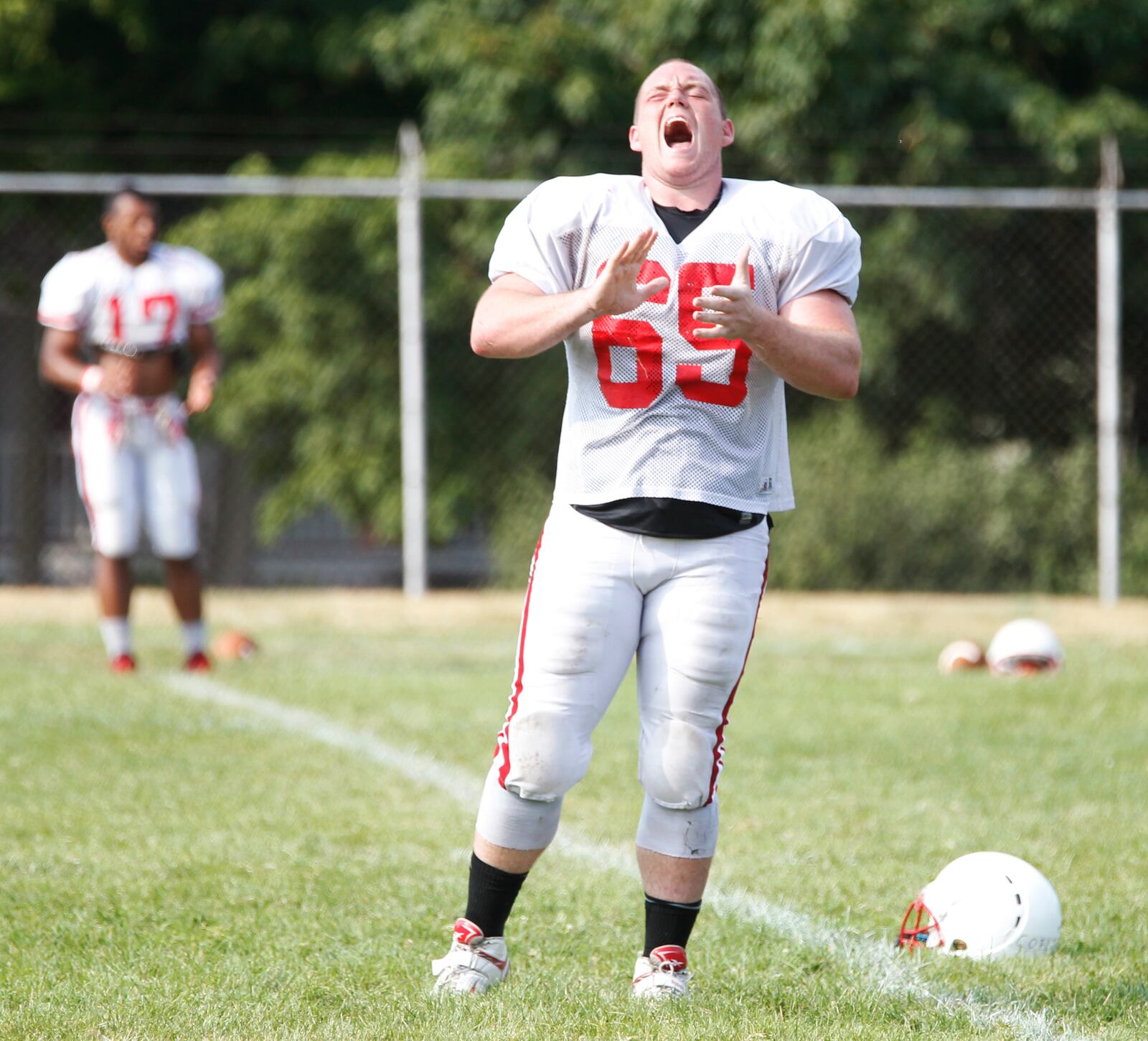 Wittenberg offensive lineman Aaron Coeling claps during practice on Monday, Aug. 18, 2014, in Springfield.