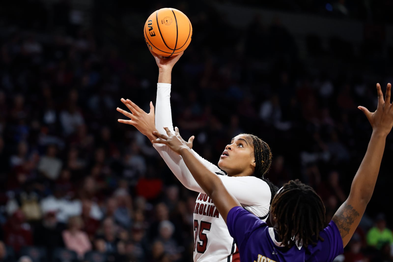 South Carolina center Sakima Walker (35) shoots against East Carolina forward Amiya Joyner, right, during the second half of an NCAA college basketball game in Columbia, S.C., Sunday, Nov. 17, 2024. (AP Photo/Nell Redmond)